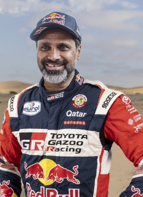 Team 1, Car 200 Driver Nasser Al-Attiyah with hands on hipe smiling to camera